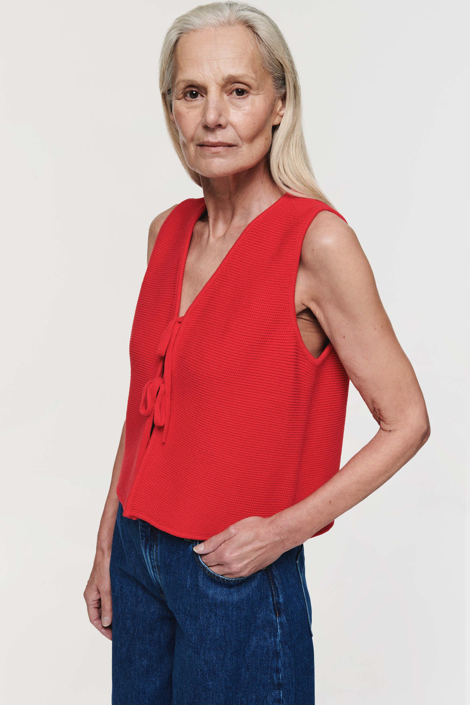 Finished in a vibrant red tone, Aligne's Isla  knitted tie tank top is a standout piece and sunny day essential. Crafted in 100% organic cotton, it has a v-neck and front tie fastening. Complete the look with a pair of shorts for a casual, effortless look or style with jeans or a denim skirt.